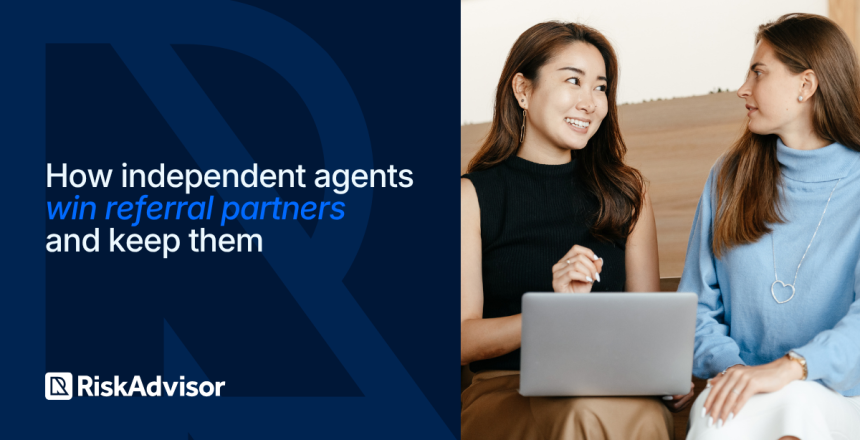 Independent insurance agent showing a referral partner a co-branded quote form on a laptop during a meeting